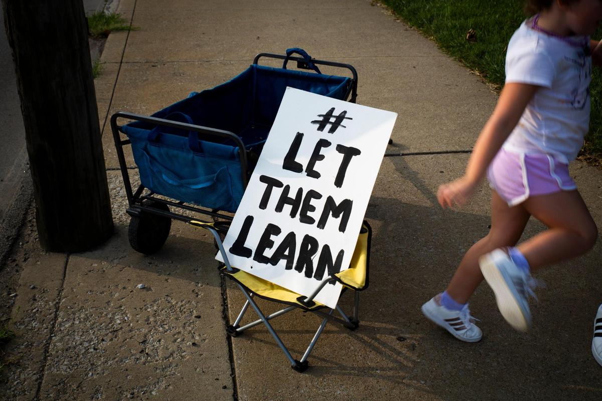 Students and parents participate in the Let Them Learn rally and protest outside the Fayette County Public Schools central office in Lexington, Ky, on Monday, September 14, 2020.