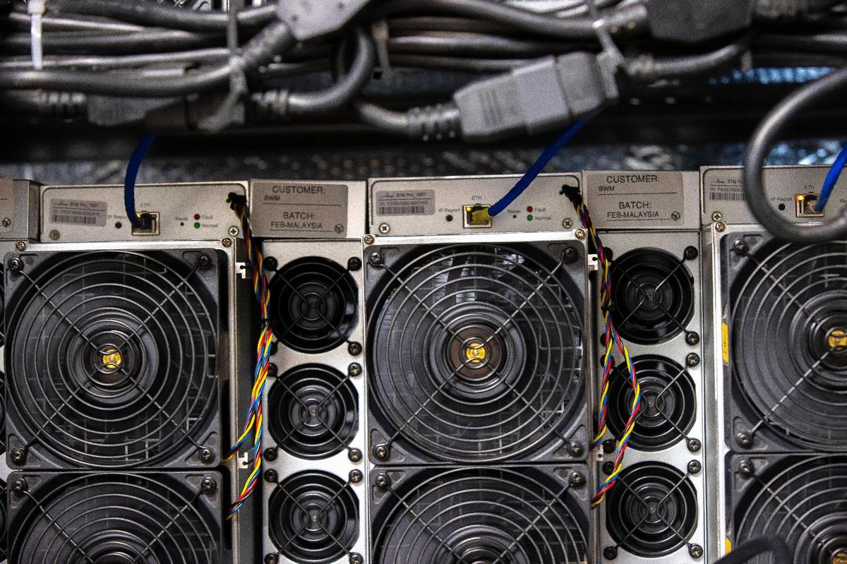 Bitcoin miners operate at Blockware Mining’s cryptocurrency mine in Paducah, Ky., on Tuesday, March 29, 2022.