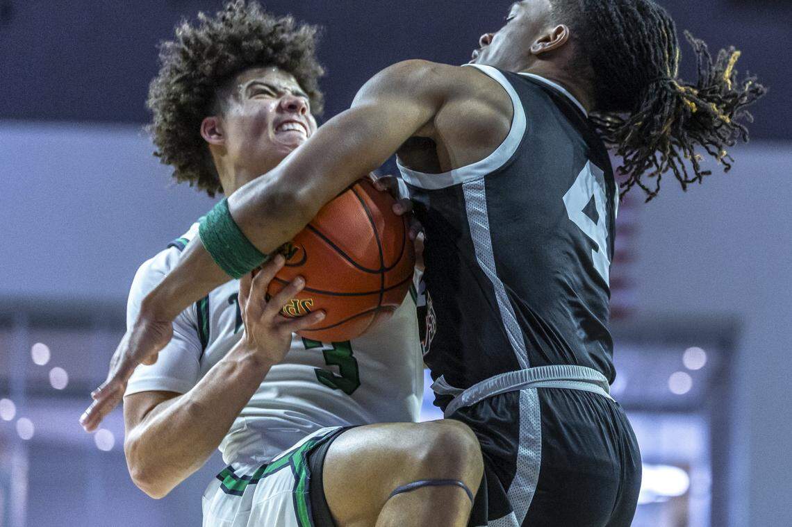 Great Crossing's Travanti Cooper (3) drives the ball as Frederick Douglass' Dakari Talbert (4) defends during the Boys 11th Region Tournament championship game at Eastern Kentucky University's Baptist Health Arena in Richmond, Ky., on Monday, March 9, 2026.