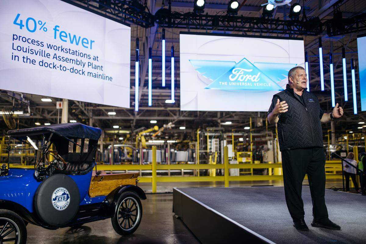 Bryce Currie, Ford vice president, Americas Manufacturing speaks during Monday’s launch event to introduce the new Ford Universal EV Platform and Ford Universal EV Production System at Louisville Assembly Plant on August 11, 2025. Louisville Assembly Plant will assemble the platform’s first vehicle – a midsize four-door electric pickup.
