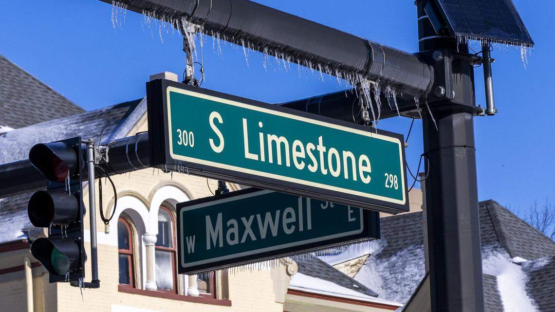 A traffic light pole and street sign are covered in ice at the intersection of Lexington’s South Limestone and West Maxwell, Jan. 28, 2026. Four days earlier, Winter Storm Fern brought heavy snowfall and ice across Lexington and Central Kentucky.