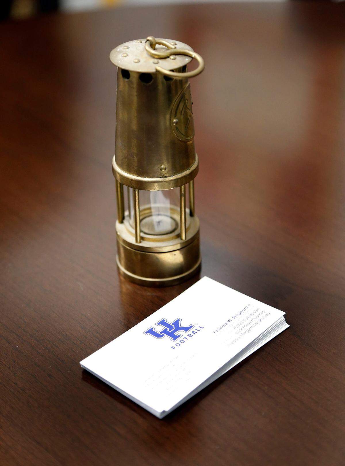 A lamp belonging to Freddie Maggard’s father, who was a coal miner in Eastern Kentucky, has a home in the younger Maggard’s office at the UK football facility. Maggard said it reminds him to keep his head down and work harder.