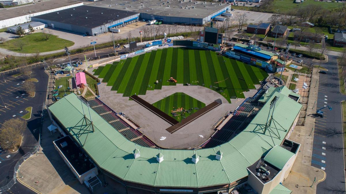 Workers install a synthetic turf field at the recently renamed Wild Health Field in Lexington last April. In addition to the turf, the ballpark underwent several enhancements last offseason including a new video board and new LED signage boards.