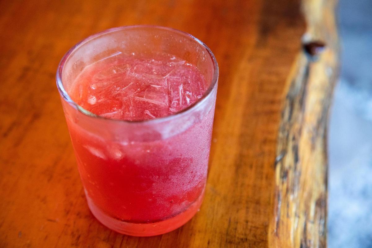 Special cocktail, “The Holler,” is Old Forester bourbon with lime and triple sec topped with Cherry Ale-8-One over ice at Hop’s Beer Garden and Restaurant.