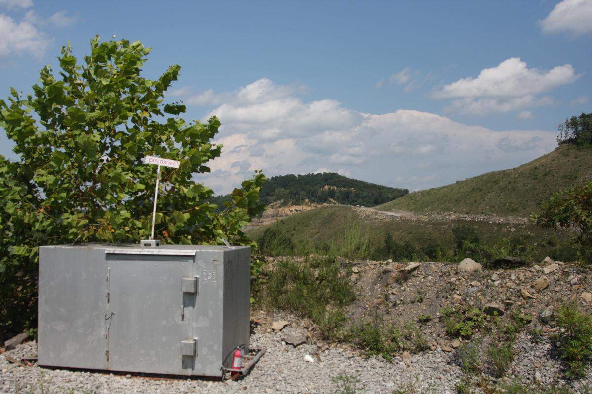Trucks offload coal in the distance at a strip mine owned by Cambrian Coal LLC., in Pike County. Cambrian plans to sell substantially all its assets in a Chapter 11 bankruptcy case filed in June 2019.