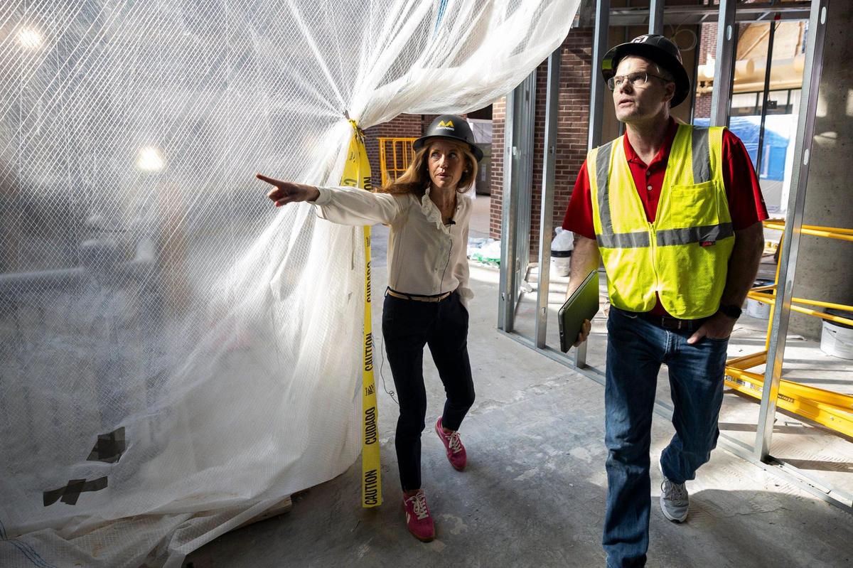 Kathryn Kaufman, a developer for the building, left, points out something to a construction manager on Friday, June 20, 2025, at 325 Main Street in Lexington, Ky.