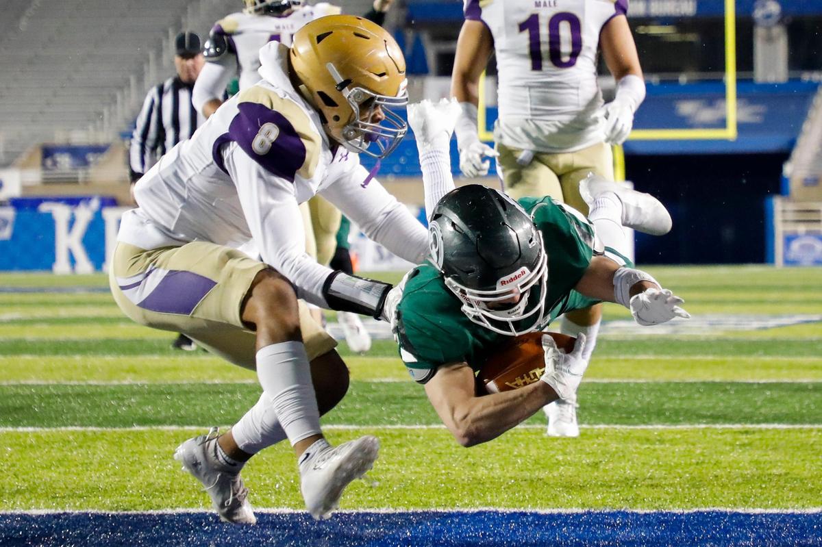 Trinity’s Brad West scored one of his three touchdowns on the night in the Shamrocks’ 28-0 victory over Male in the Class 6A state finals. West was named MVP.