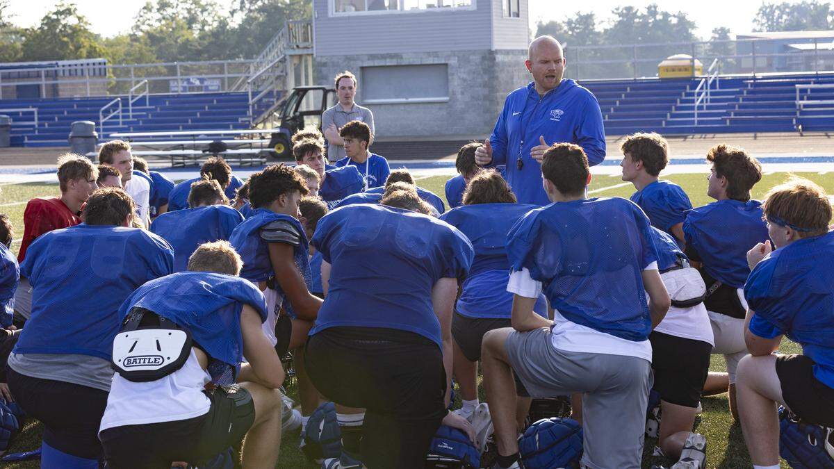 Lexington Christian football head coach Oakley Watkins delivers the final message of the day at a practice last month as the Eagles prepare for the season. LCA hosts North Hardin on Friday.