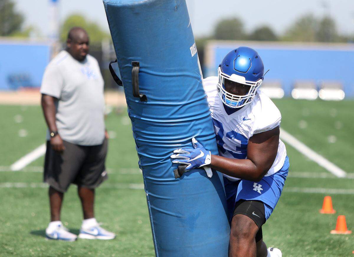 Defensive line coach Derrick LeBlanc watched Jerquavion Mahone Saturday on the practice field during UK Football Fan Day. “He’s an athlete,” LeBlanc said of Mahone. “He’s got to develop some other things, but I think he is going to be a good player.”