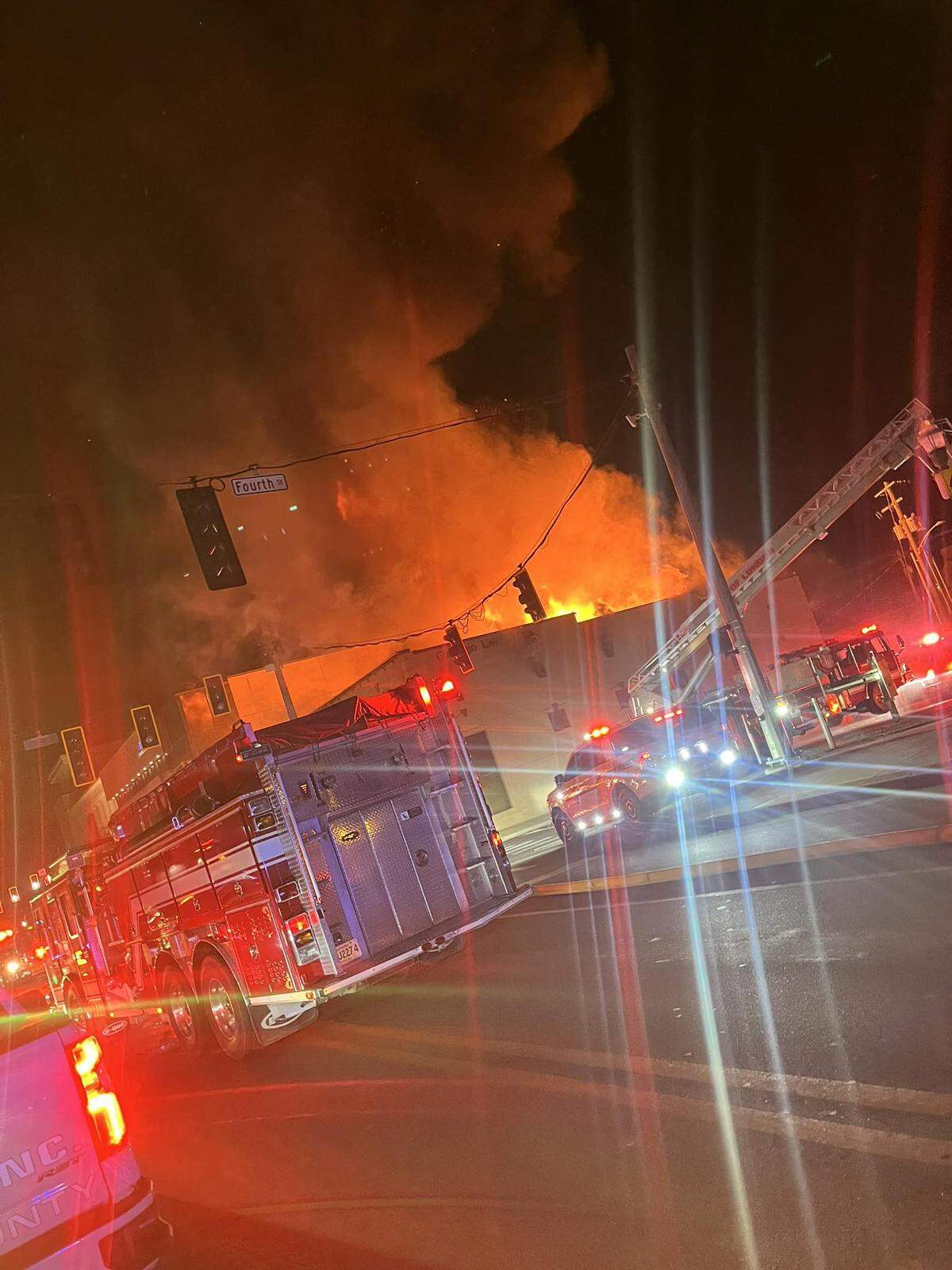 Firefighters battle a large commercial fire in downtown London, Ky., Jan. 13, 2026.