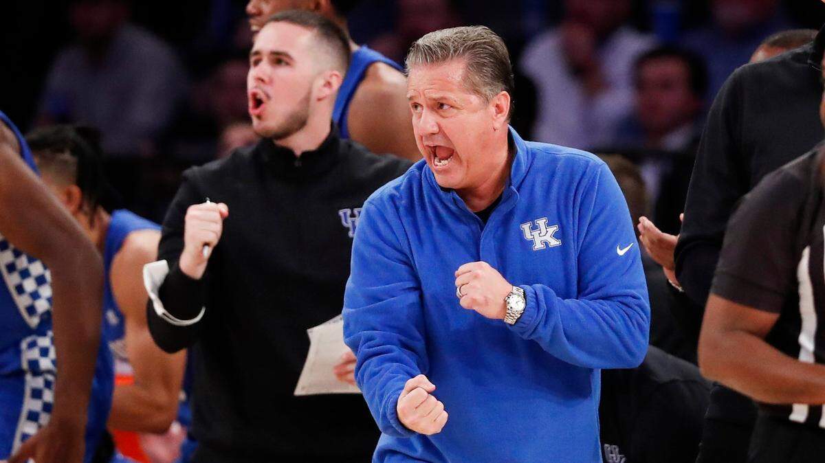 Kentucky’s John Calipari, right, coached alongside his son and graduate assistant coach, Brad Calipari, during the Champions Classic against Duke at Madison Square Garden in New York City on Nov. 9. Brad also played for his dad at UK.