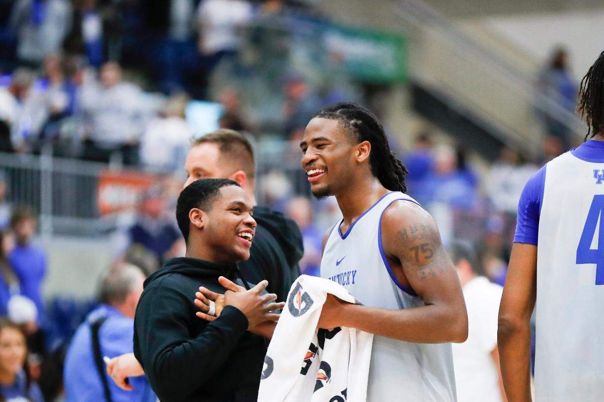 Kentucky guard Sahvir Wheeler, left, shakes hands with teammate Cason Wallace after the Blue-White Game in Pikeville on Oct. 22.