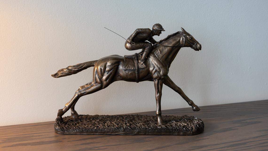 A horse racing statue serves as unique decor in a lavish suite at Hotel Thoroughbred, a 19-room boutique hotel undergoing restoration in downtown Paris, Ky, on Dec. 4, 2025.