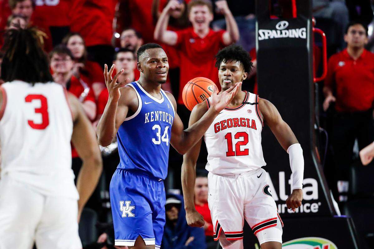 Kentucky forward Oscar Tshiebwe (34) reacts to a foul call during Saturday’s loss to Georgia at Stegeman Coliseum in Athens, Ga.