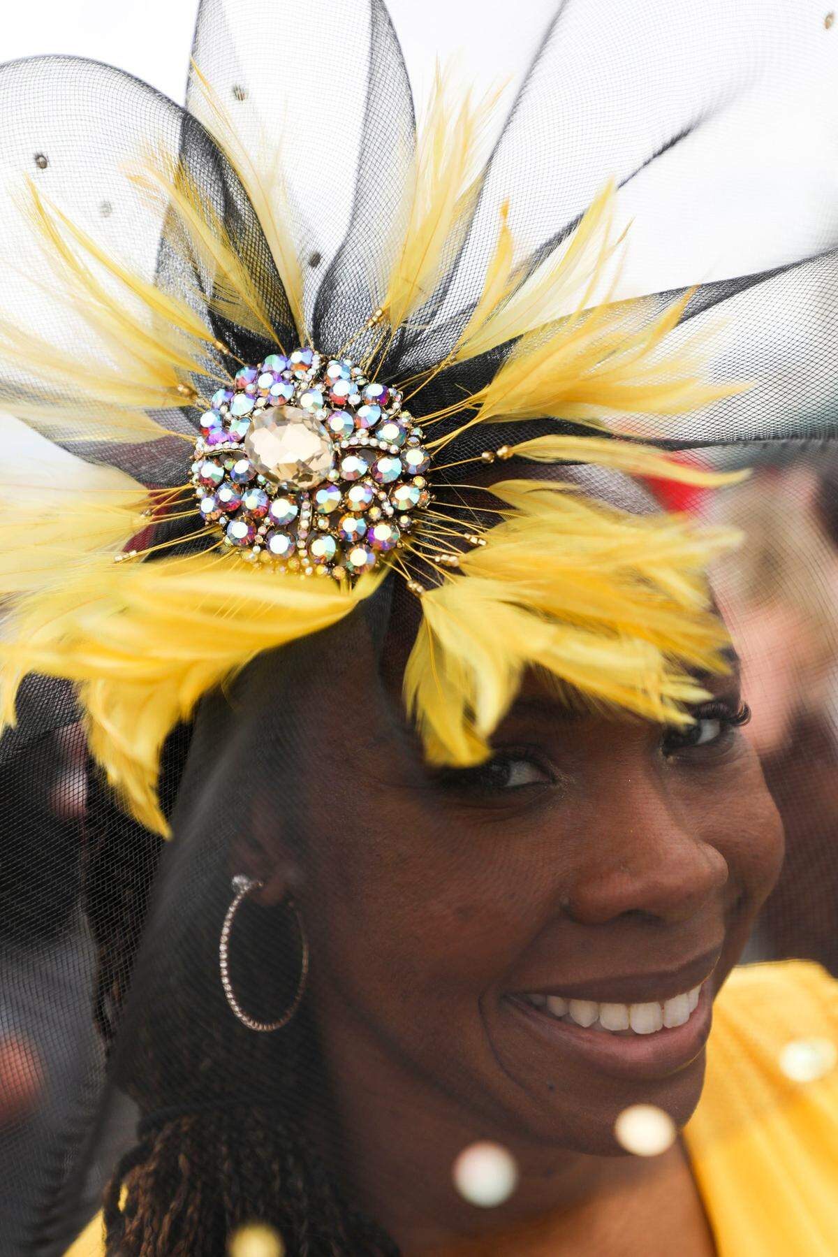 Brandalynn Lugo wears a vibrant yellow fascinator at Churchill Downs in Louisville, Ky., Saturday, May 6, 2023.
