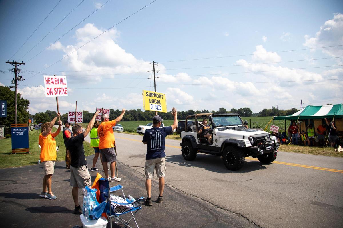 Members of Local 23D Union picket in front of Heaven Hill Distillery in Bardstown, Ky., Monday, September 13, 2021.