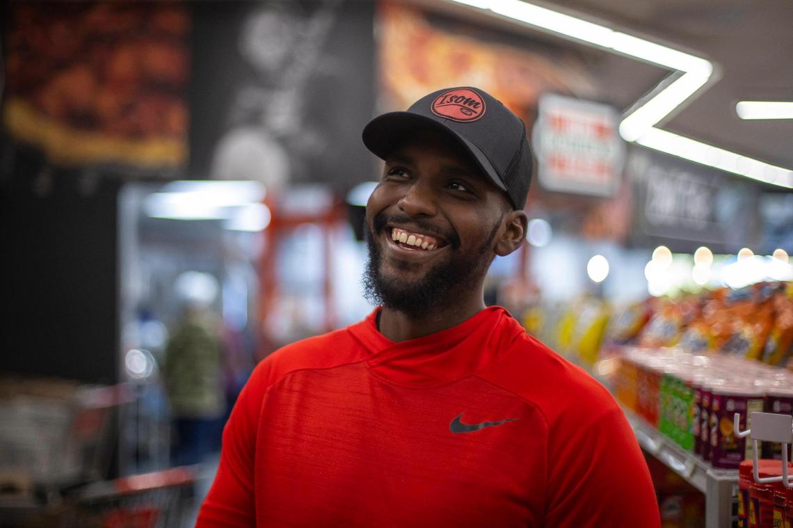 Simon Christon, whose parents – Gwen and Arthur Christon – own Isom IGA in Isom, Ky., smiles while giving a tour of the grocery store on Thursday, March 30, 2023.