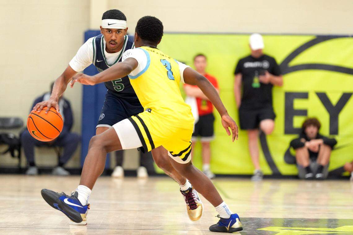 July 15, 2025; North Augusta, South Carolina, USA; Oakland Soldiers Jason Crowe Jr. (5) dribbles as Team Final RJ Smith (3) defends during the Oakland Soldiers and Team Final game at Nike EYBL Peach Jam at Riverview Park Activities Center. The Oakland Soldiers won 86-75. Mandatory Credit: Katie Goodale - Augusta Chronicle/USA TODAY NETWORK