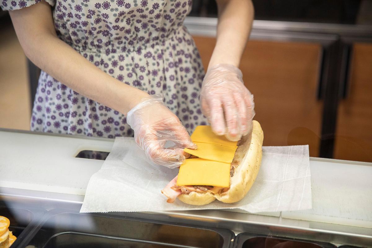 Angela Gerber maked a sub to order at Walnut Leaf Country Market. You get your choice of lots of meats, nine types of bread and multiple cheeses.