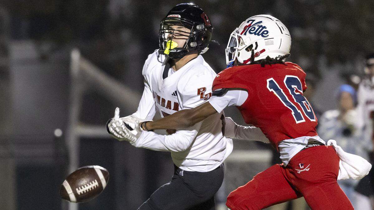 Lafayette's Derrion Jones (16) breaks up a late, fourth-quarter pass intended for Paul Laurence Dunbar's Conner Norsworthy (13), sealing the General's 21-10 win over Paul Laurence Dunbar in a KHSAA high school football game, Friday, Oct. 24, 2025 at Lafayette High School in Lexington, Ky.