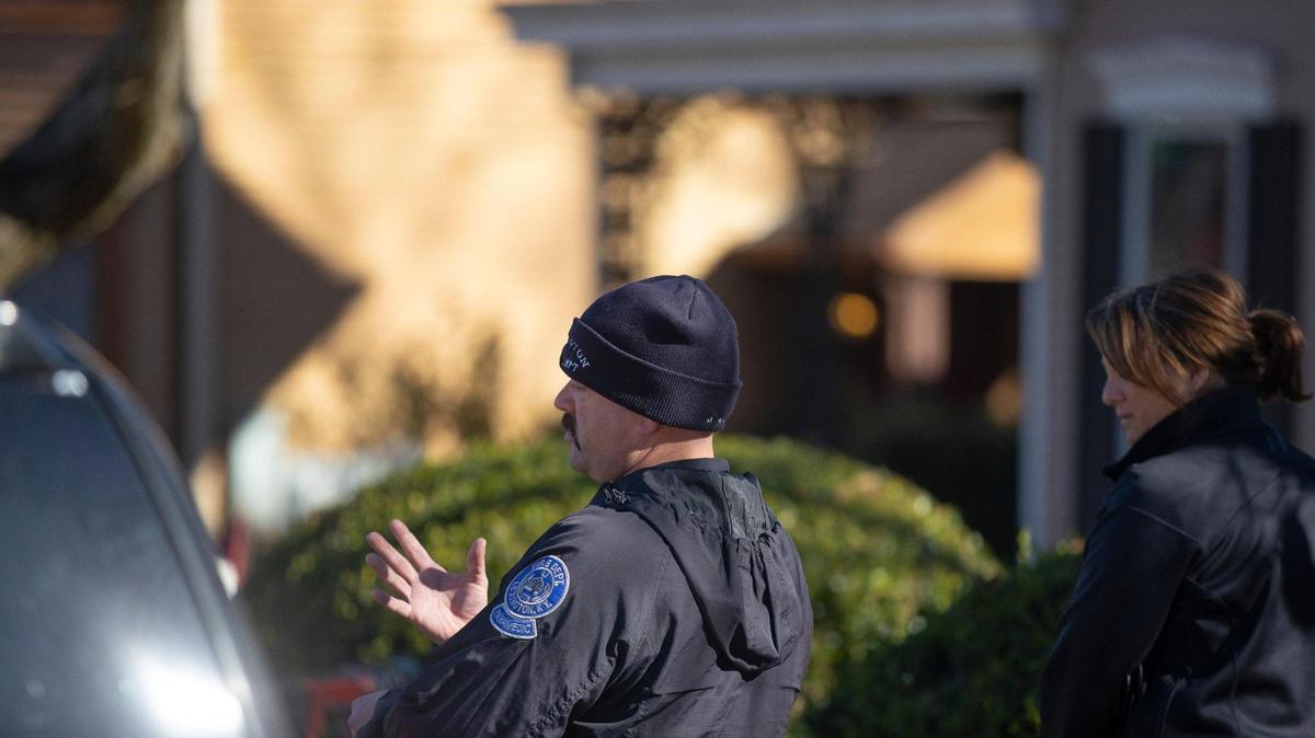 Lexington Fire Department firefighter Patrick Branam talks with a person while looking for someone who had recently overdosed on opioids and been revived in Lexington, Ky., on Monday, Nov. 29, 2021.