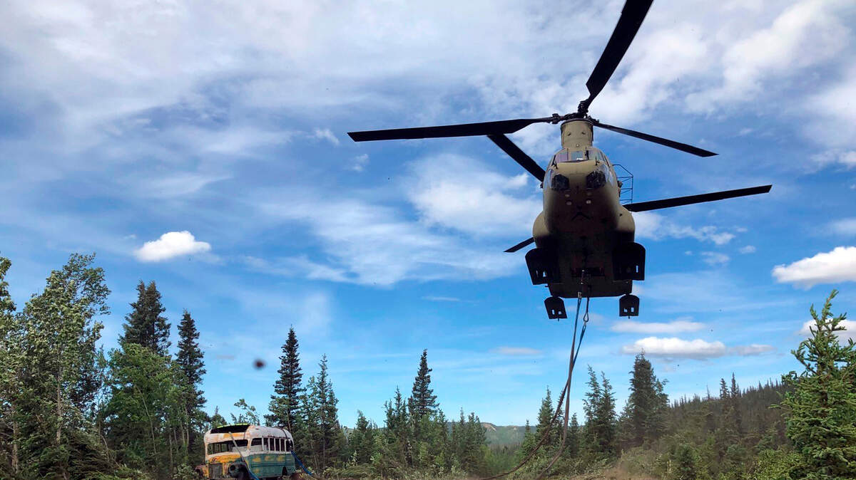 An image provided by the Alaska National Guard, a helicopter removes the abandoned bus popularized by the book and movie “Into the Wild,” from the Alaskan backcountry, June 18, 2020. (Sgt. Seth LaCount/Alaska National Guard via The New York Times)