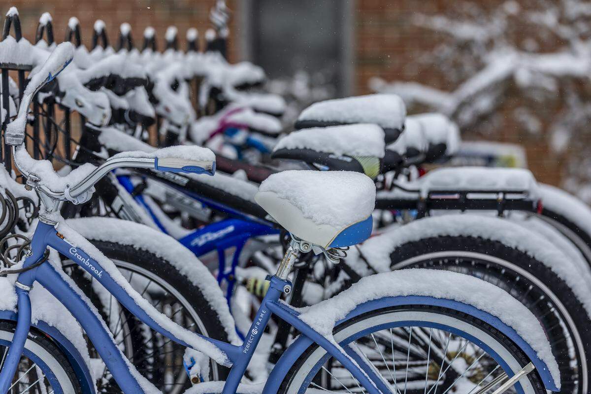 Snow covers bicycles outside R.H. White Hall on the Murray State University Campus in Murray, Ky., on Friday, Jan. 10, 2025.