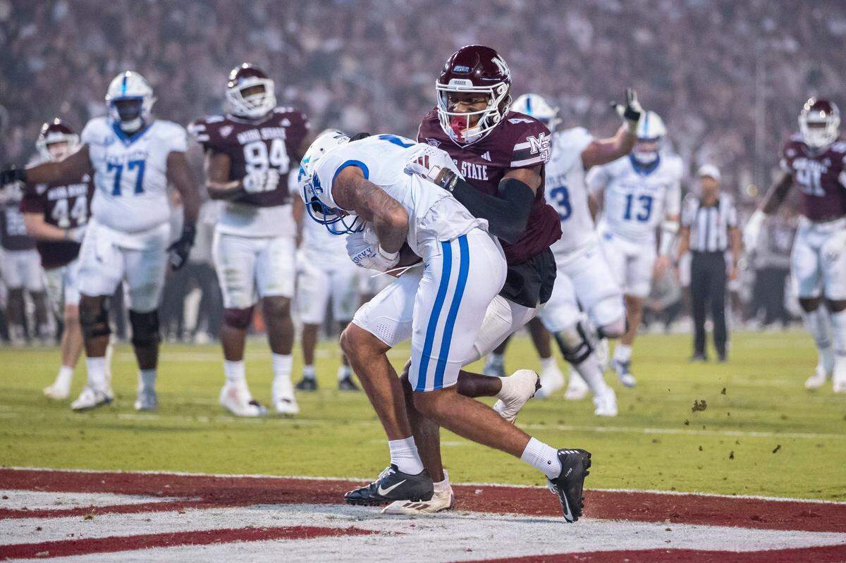 Kentucky wide receiver Dane Key scores a touchdown against Mississippi State cornerback DeCarlos Nicholson during Saturday’s game.