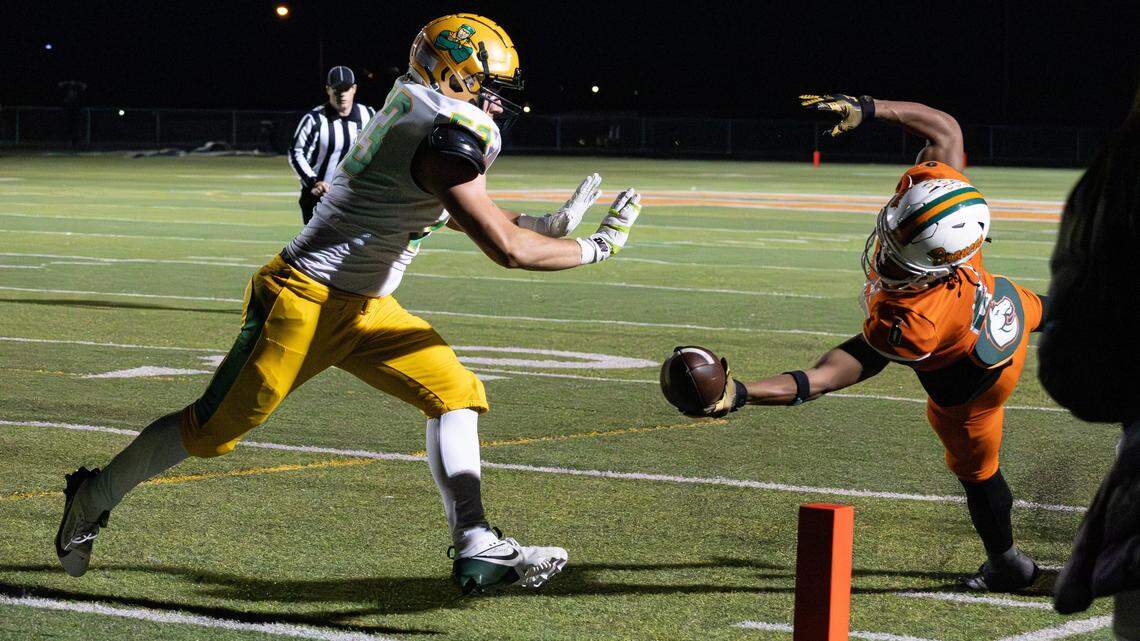 Broncos RB Dakari Talbert (6) makes a pylon dive touchdown during the Class 6A second round playoff game between the Bryan Station Defenders and Frederick Douglass on Nov. 14, 2025, in Lexington, Ky.