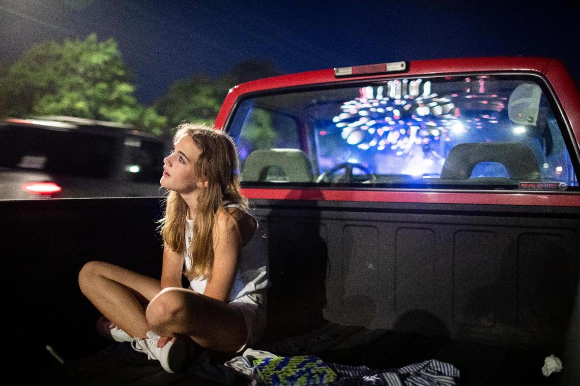 Neighborhood children watch as fireworks are set off on Fifth Street in Lexington, Ky., Saturday, July 3, 2021.