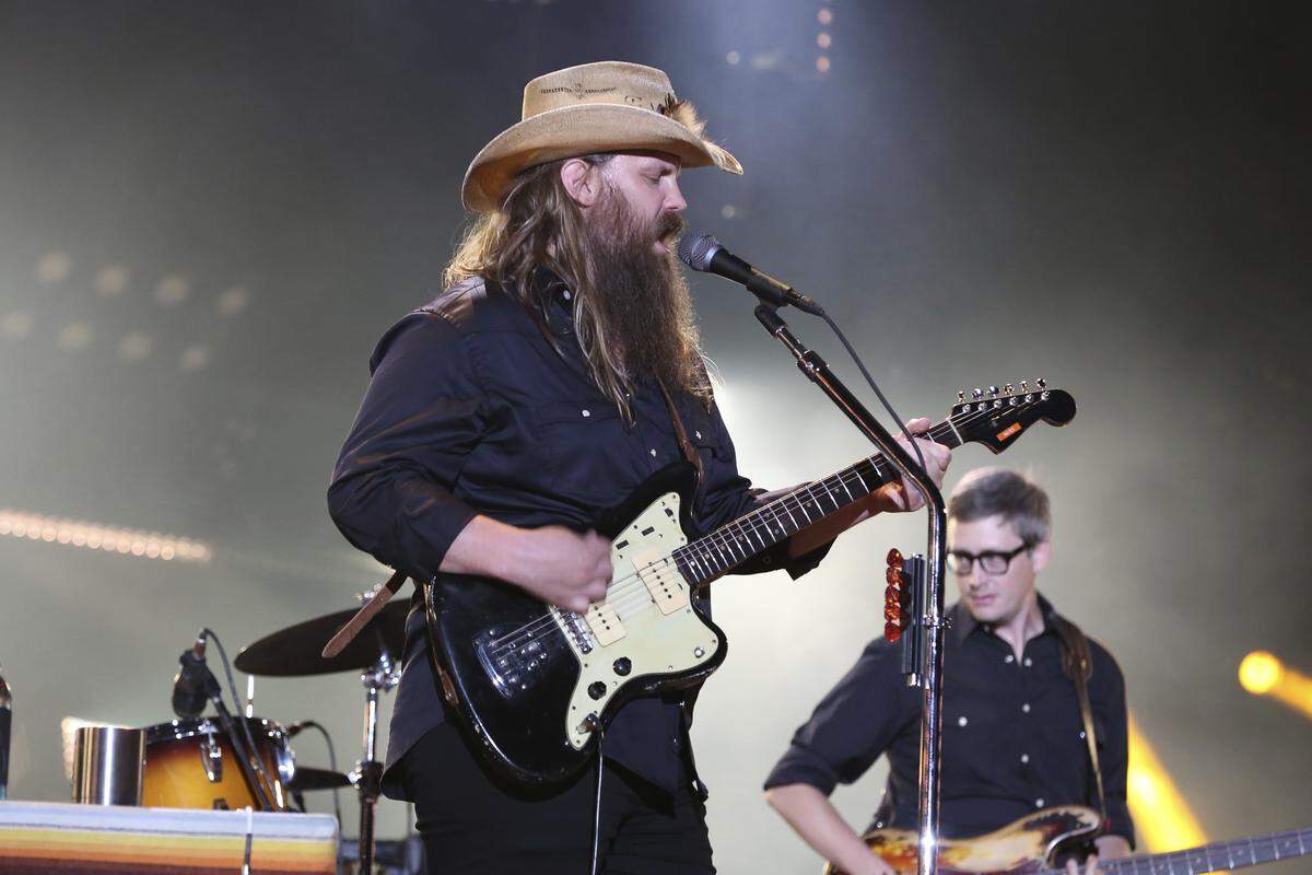 Chris Stapleton performs at the 2018 CMA Music Festival at Nissan Stadium in Nashville with bassist J.T. Cure.