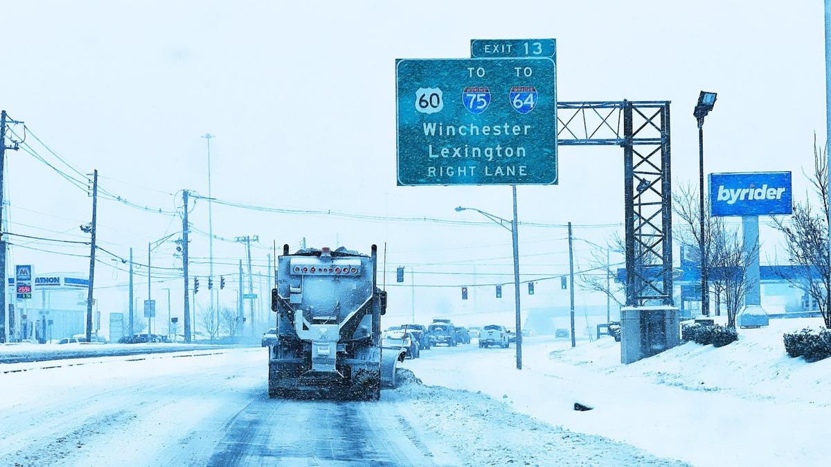 A city salt truck moves snow and lays salt at exit 13 on January 5, 2025, in Lexington Ky.