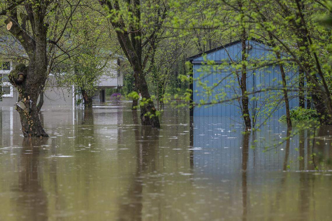 The Kentucky River floods homes and buildings along Palisades Road in Mercer County, Ky., on Saturday, April 5, 2025.
