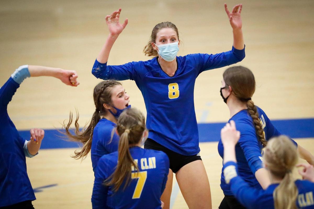 Henry Clay’s Abby Shadwick (8) celebrated a point with her teammates during the Blue Devils’ win over Corbin on Monday.