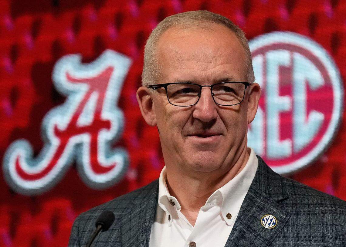SEC commissioner Greg Sankey introduces Alabama coach Kristy Curry during the league’s media day in Birmingham, Alabama, on Oct. 16, 2024.