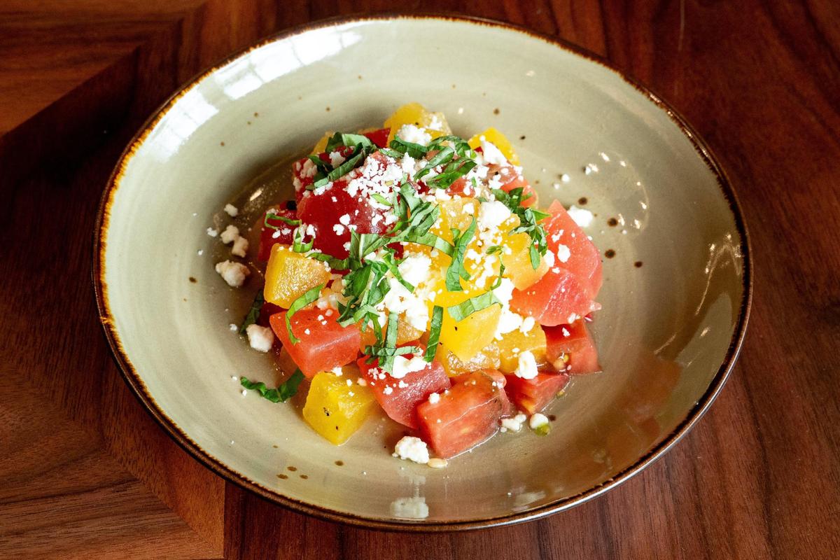 The Griller Watermelon Salad ($15) at Crafted at Boone Tavern at the Historic Boone Tavern Hotel in Berea, Ky. features Berea College Farm heirloom tomatoes, feta, basil, and cucumber.