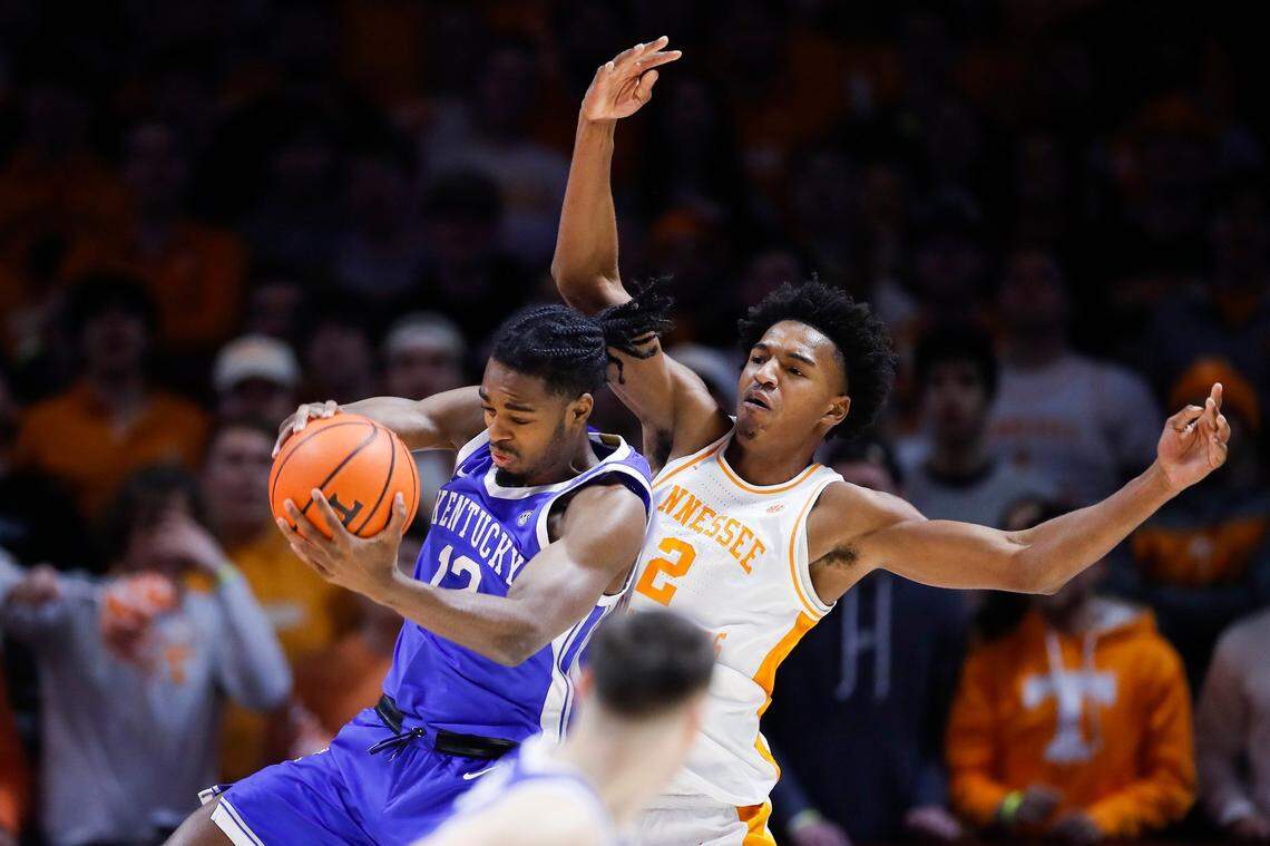 Kentucky’s Antonio Reeves (12) grabs a rebound from Tennessee’s Julian Phillips (2) during Saturday’s game.