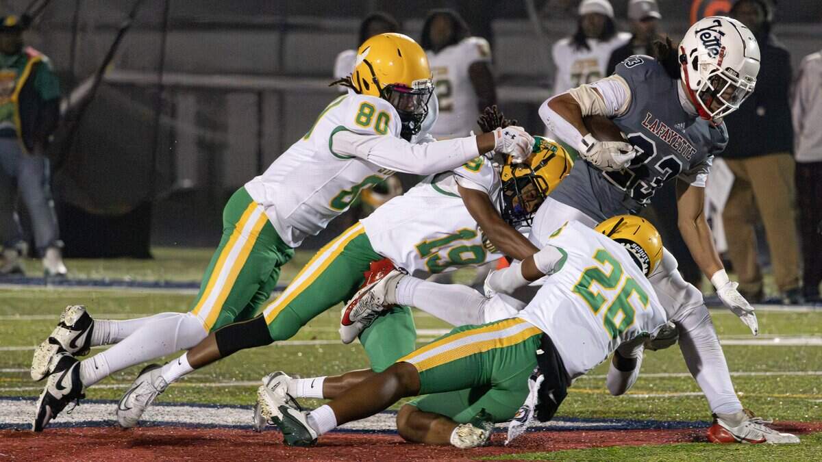 Defenders defense stops Generals RB Tyree Richardson (23) from gaining additional yards during the Class 6A first-round game between Bryan Station and Lafayette on Nov. 7, 2025, in Lexington, Ky.