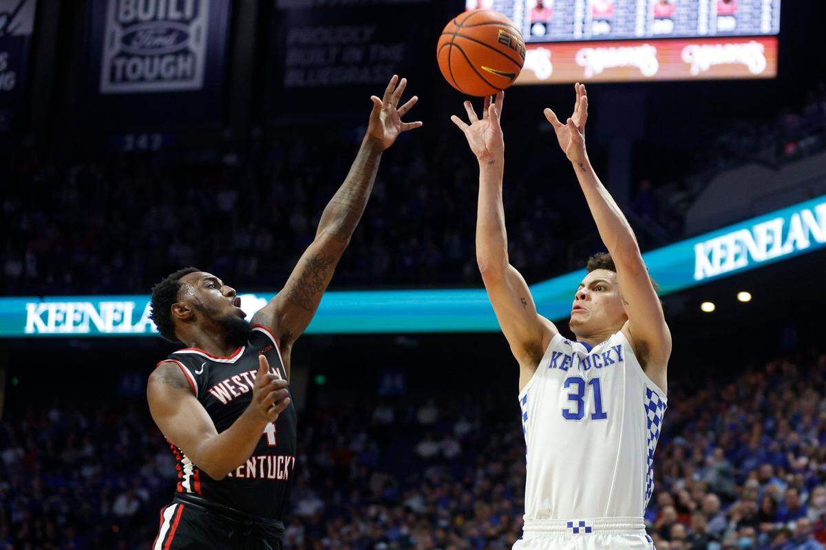 Kentucky Wildcats guard Kellan Grady (31) shoots over Western Kentucky Hilltoppers guard Josh Anderson (4) during a game at Rupp Arena in Lexington, Ky., Wednesday, Dec. 22, 2021.