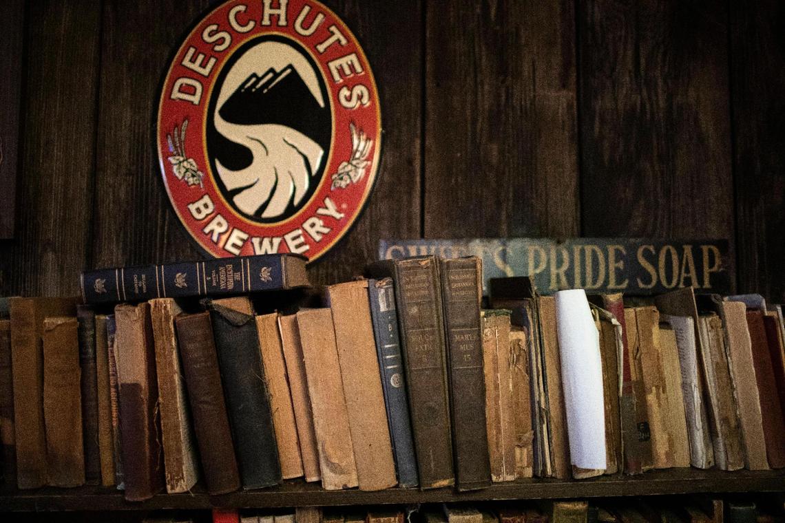 Most of the books on the walls inside Charlie Brown’s have been there for 50 years, since the place opened as The Rust Nail in 1973.