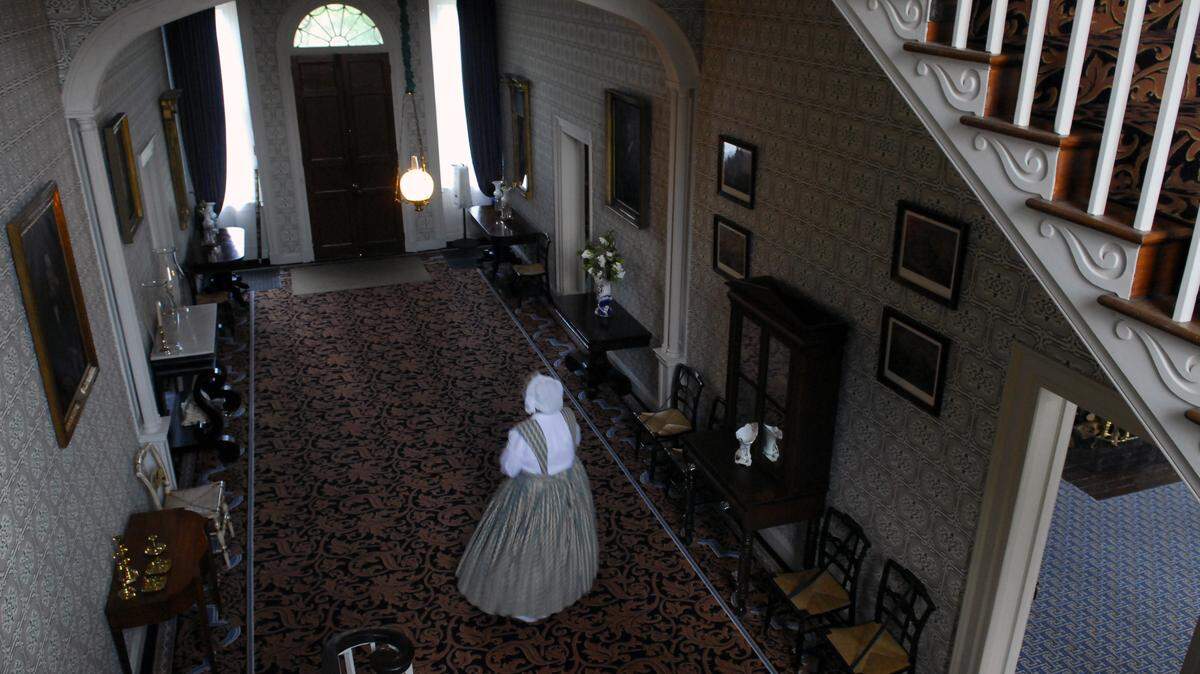 My Old Kentucky Home tour guide Gillian Fell in the mansion's main hall. Federal Hill mansion has been open to the public since soon after the state bought it in 1922.   Photo by Tom Eblen | Staff  