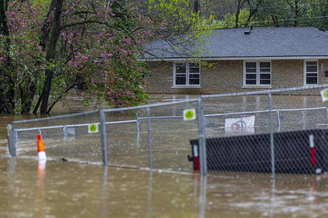 The Kentucky River surrounds a home on Watson Court in downtown Frankfort, Ky., on Saturday, April 5, 2025.
