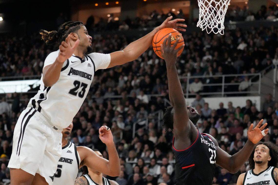 Bryce Hopkins (23) blocks a shot in Providence’s 73-61 win against then-No. 4 UConn on Jan. 4. The former UK forward scored 27 points against the Huskies.