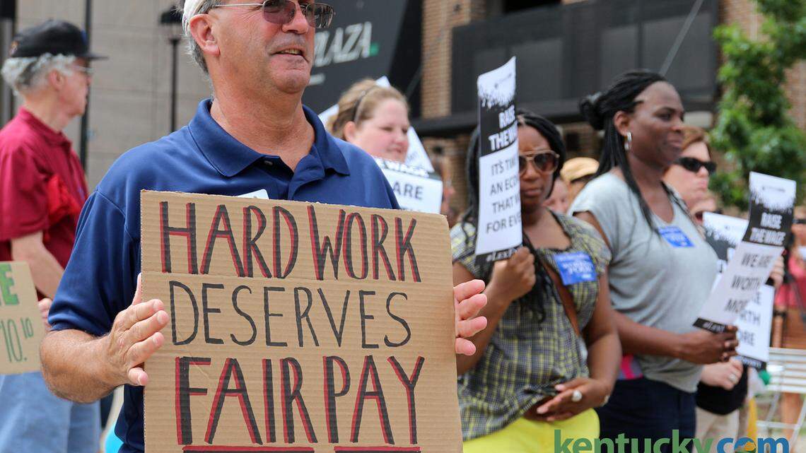 Bob McNulty participated in a rally, supporting the cause of fair pay by raising the minimum wage at Phoenix Park in Lexington on Tuesday June 23, 2015. Photo by Andrea Noall | Staff