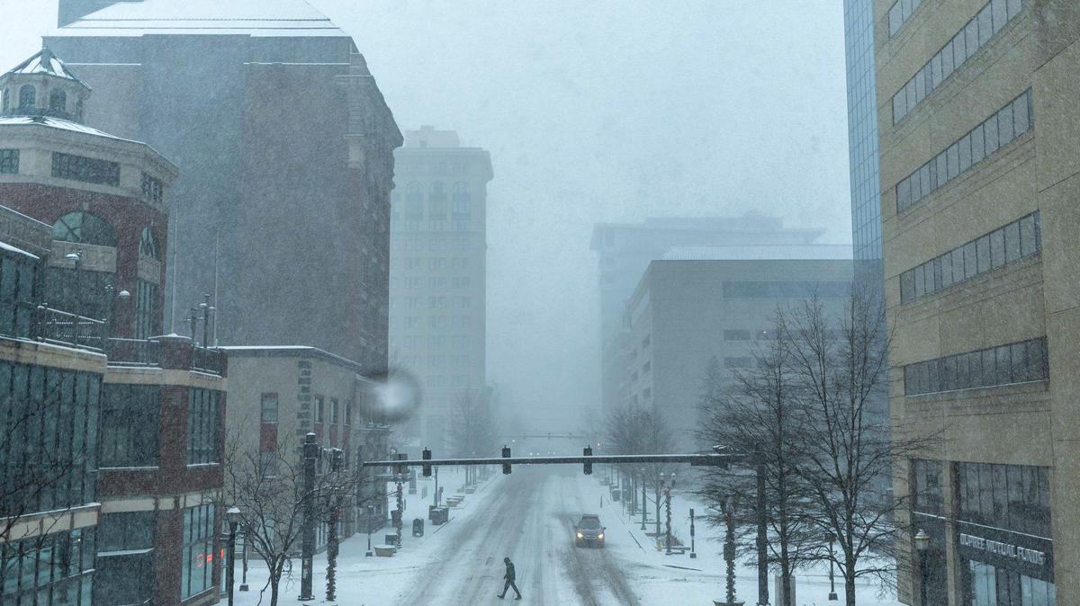 A person crosses Main Street in downtown Lexington, Ky., on Sunday, Jan. 5, 2025.