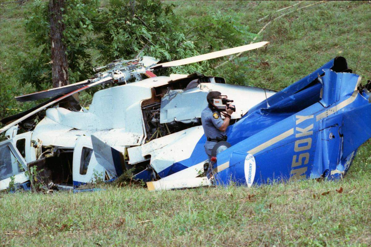 Kentucky State Trooper Gregg Muravchick videotaped the wreckage of Governor Brererton Jones’ helicopter on August 7, 1992 in Shelby County. The 12 year-old Sikorsky helicopter went down on a steep hillside near Interstate 64 and skidded into a locust tree. Photo by Ron Garrison | Staff
