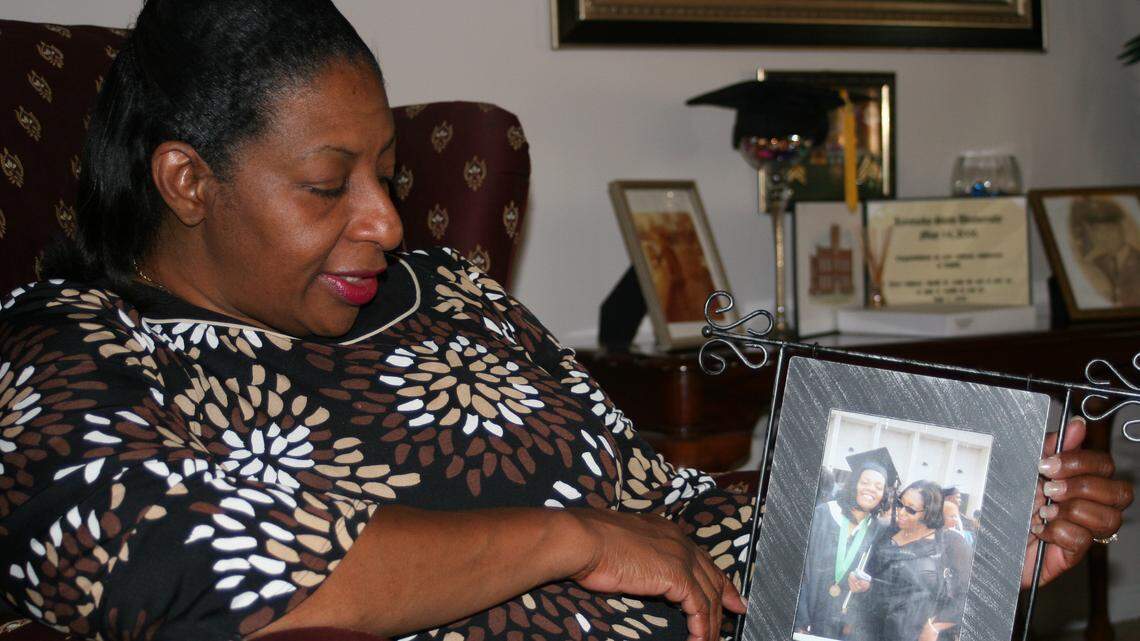 Among Ramona White's mementos is a picture of her and daughter Tomma Graves on the day Graves graduated from college. She said Tomma was sick that day but determined to walk across the stage.  