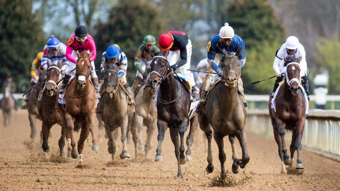 Zandon, with Flavien Prat up in the blue silks, crosses the finish line to win the Blue Grass Stakes on April 9 at Keeneland.
