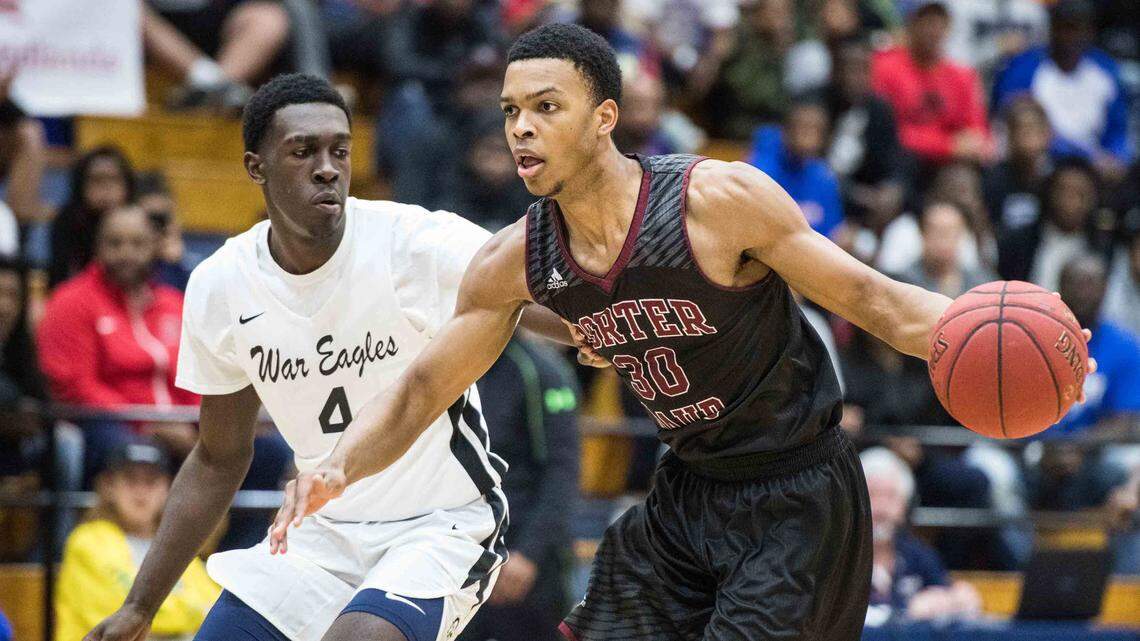 Porter-Gaud guard Josiah James (30) dribbles the ball against Gray Collegiate forward Juwan Gary (4) during the Chick-fil-a Classic in December.