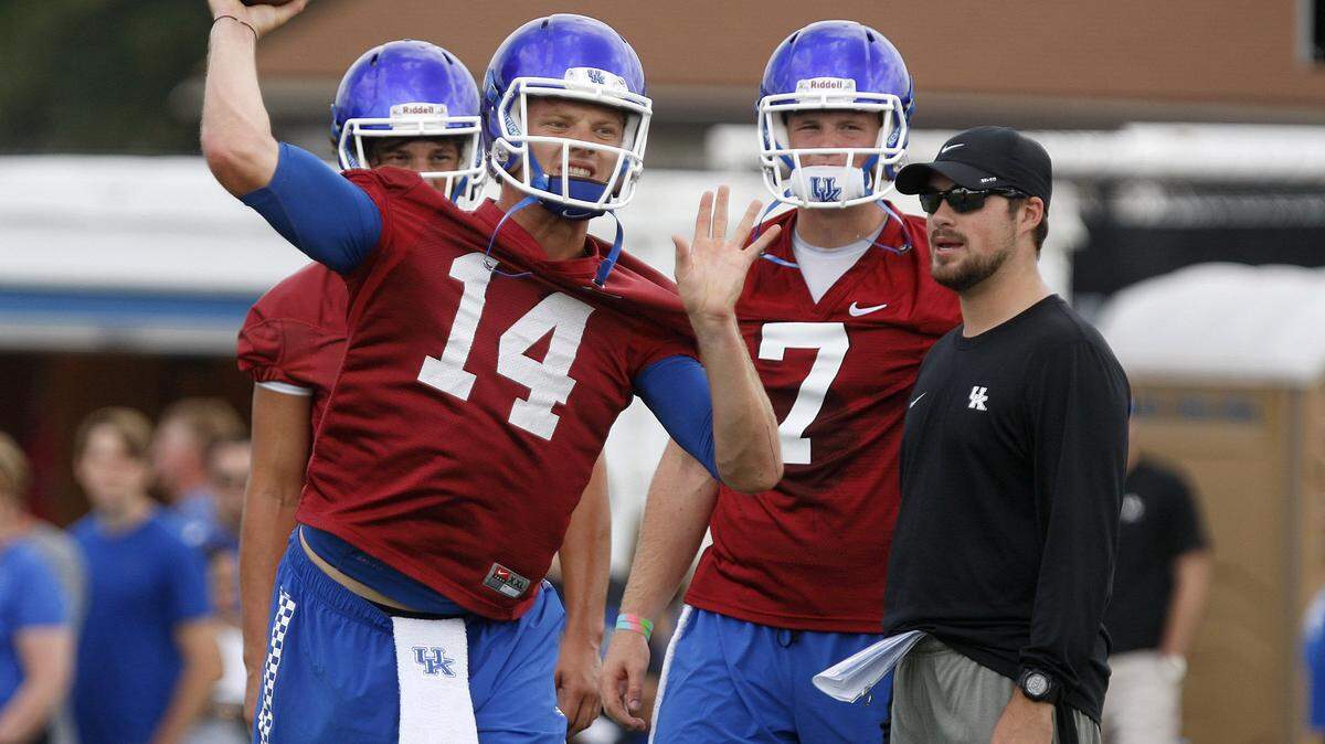 UK's incumbent quarterback, Patrick Towles, threw in practice last Saturday as redshirt freshman Drew Barker (7) waited for his turn. In 1990, U of L rode a two-QB model to a Fiesta Bowl win and the Cards again had success with a tandem plan in 2004, behind Stefan LeFors and Brian Brohm.
  
